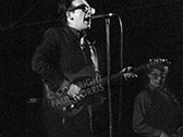 A photo of Elvis Costello and Bruce Thomas of The Attractions taken in Bristol.